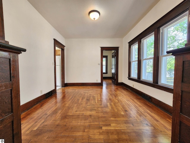 unfurnished room featuring baseboards