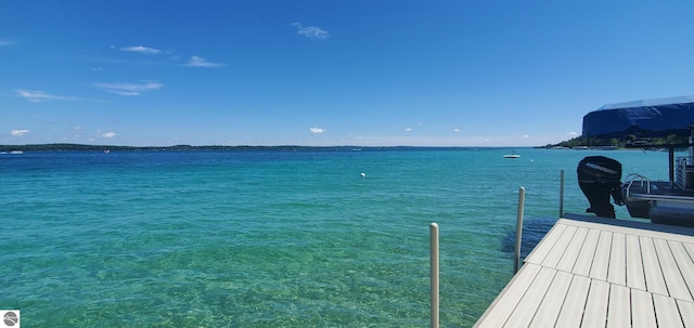 7079 Torch Lake Dr NW, Kewadin, MI 49648 - dock with a water view