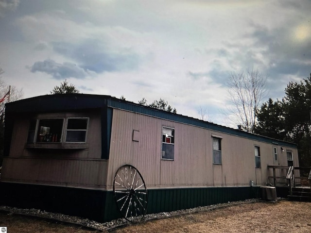 4151 Fraser Rd, Glennie, MI 48737 - view of side of home featuring central AC unit