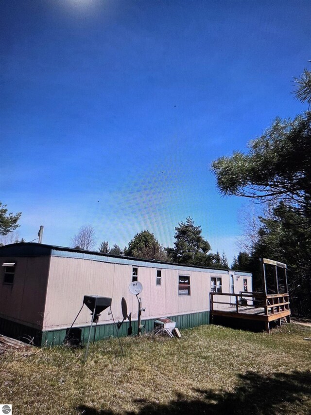 4151 Fraser Rd, Glennie, MI 48737 - back of property with a wooden deck