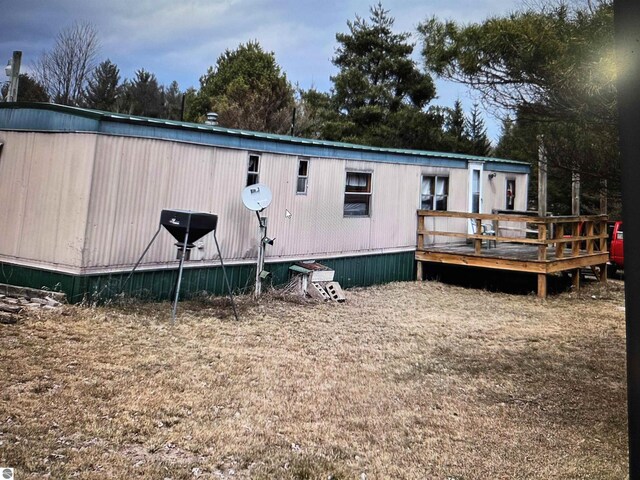 4151 Fraser Rd, Glennie, MI 48737 - rear view of house with a wooden deck
