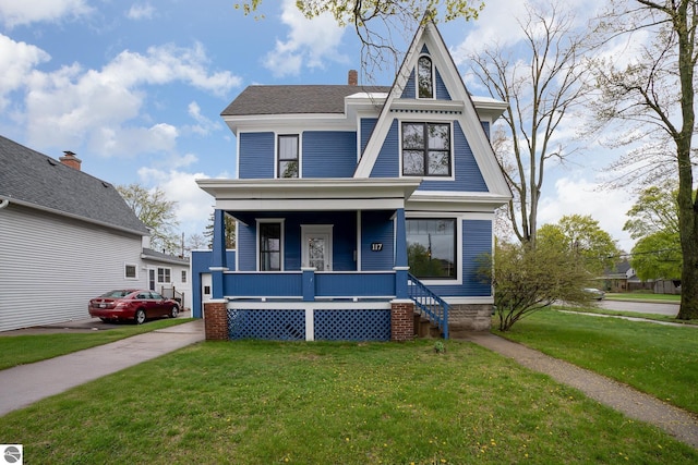 117 S Fancher St, Mount Pleasant, MI 48858 - view of front facade with a porch and a front yard