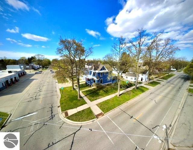 117 S Fancher St, Mount Pleasant, MI 48858 - view of asphalt road with curbs, sidewalks, and a residential view