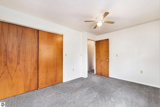 4120 M-66, Kalkaska, MI 49646 - unfurnished bedroom featuring carpet, a closet, baseboards, and a ceiling fan