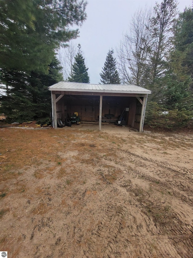 4120 M-66, Kalkaska, MI 49646 - view of parking with an outbuilding