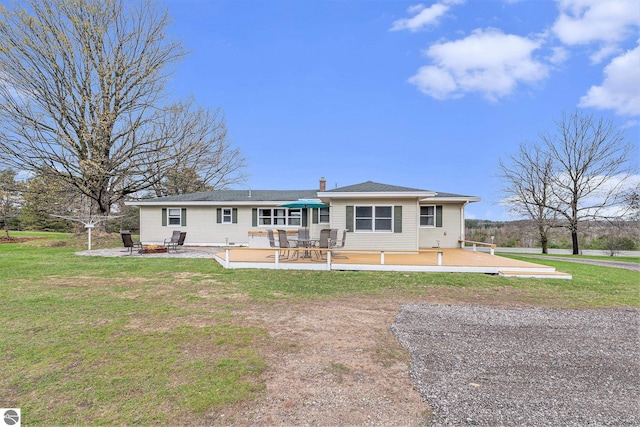 4120 M-66, Kalkaska, MI 49646 - back of house featuring a yard and a patio area