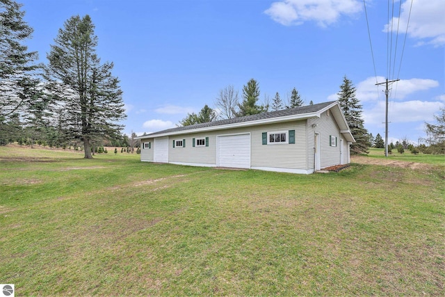 4120 M-66, Kalkaska, MI 49646 - rear view of property featuring a lawn and an outdoor structure