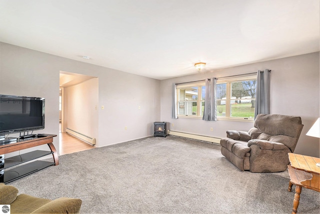 4120 M-66, Kalkaska, MI 49646 - living room with a baseboard radiator, baseboard heating, light colored carpet, and baseboards