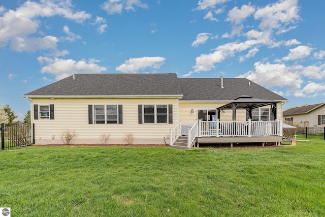 726 Doe Trl, Mount Pleasant, MI 48858 - back of property featuring a gazebo, a deck, and a shingled roof