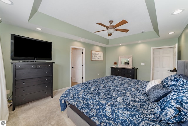 726 Doe Trl, Mount Pleasant, MI 48858 - bedroom featuring light colored carpet, a raised ceiling, recessed lighting, and a ceiling fan