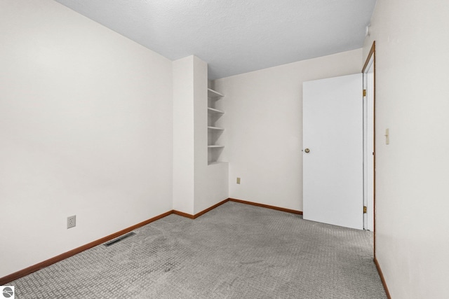 203 W Sixteenth St, Traverse City, MI 49684 - empty room with carpet and baseboards