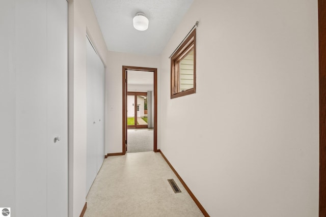203 W Sixteenth St, Traverse City, MI 49684 - hallway with baseboards and light carpet