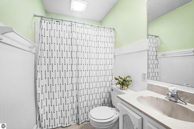 203 W Sixteenth St, Traverse City, MI 49684 - bathroom with toilet, vanity, and curtained shower