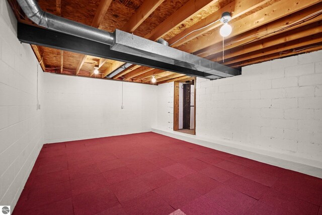 203 W Sixteenth St, Traverse City, MI 49684 - below grade area with dark flooring