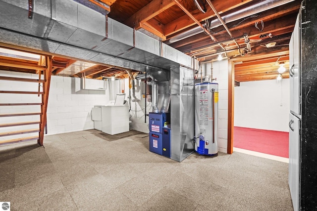 203 W Sixteenth St, Traverse City, MI 49684 - unfinished basement with gas water heater, separate washer and dryer, heating unit, and stairway