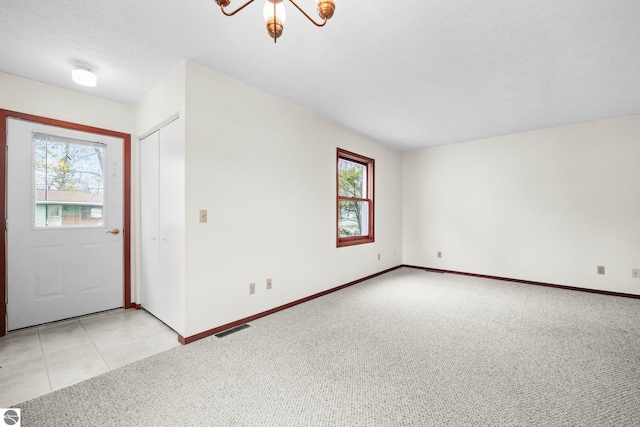 203 W Sixteenth St, Traverse City, MI 49684 - foyer entrance with plenty of natural light, light colored carpet, and baseboards
