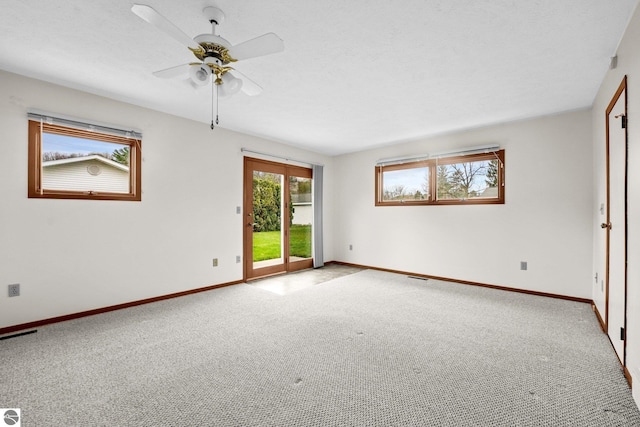 203 W Sixteenth St, Traverse City, MI 49684 - carpeted spare room with baseboards and ceiling fan