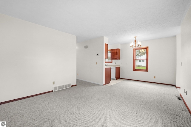 203 W Sixteenth St, Traverse City, MI 49684 - unfurnished living room with a chandelier, light carpet, and baseboards