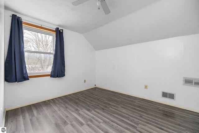 additional living space featuring vaulted ceiling, wood finished floors, ceiling fan, and baseboards