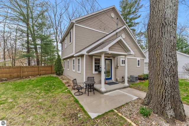 5945 E M-55, Cadillac, MI 49601 - back of property with central air condition unit and a patio area
