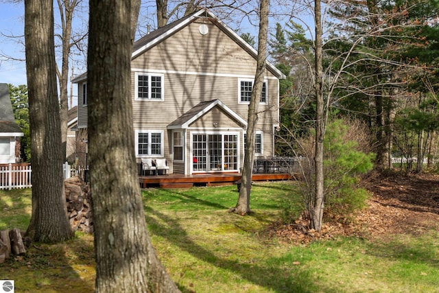 5945 E M-55, Cadillac, MI 49601 - back of house featuring a deck and a yard