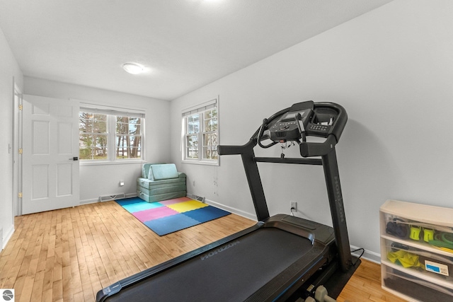 5945 E M-55, Cadillac, MI 49601 - workout area featuring wood-type flooring and baseboards