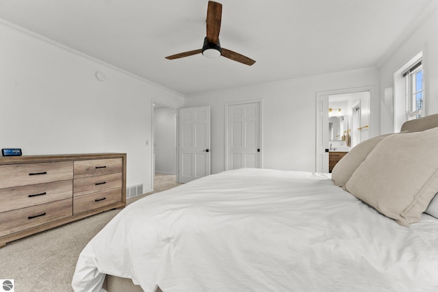 5945 E M-55, Cadillac, MI 49601 - carpeted bedroom with connected bathroom, ceiling fan, and ornamental molding