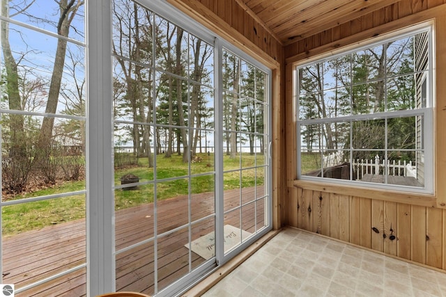 5945 E M-55, Cadillac, MI 49601 - unfurnished sunroom with a water view and healthy amount of natural light