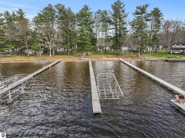 5945 E M-55, Cadillac, MI 49601 - dock area featuring a water view and view of wooded area
