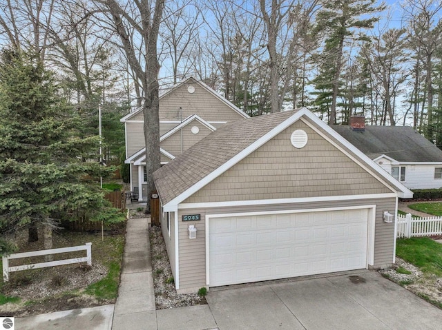 5945 E M-55, Cadillac, MI 49601 - view of front of home featuring fence and driveway