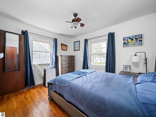 bedroom with wood finished floors and ceiling fan