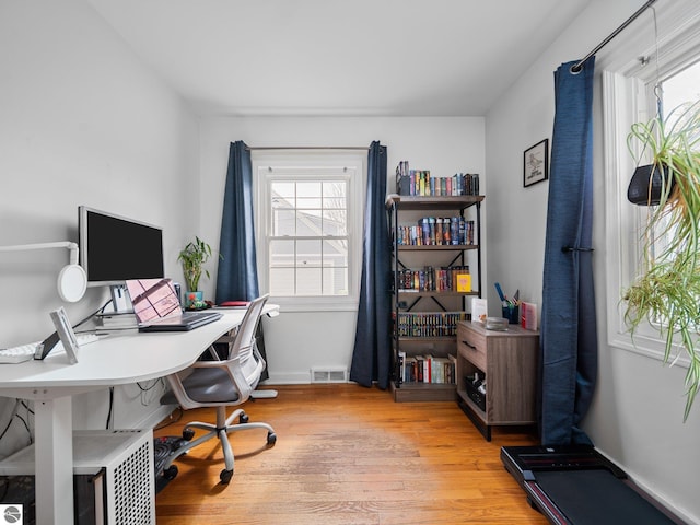 office area featuring light wood-style flooring