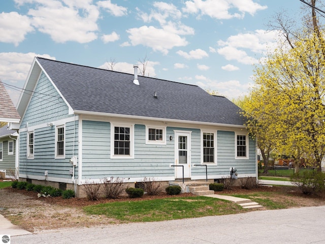 view of front of house featuring roof with shingles