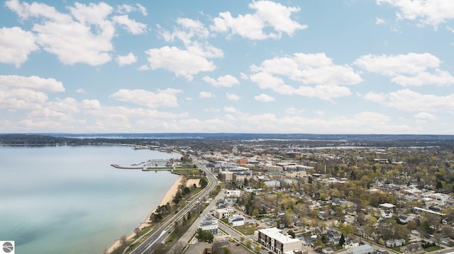 aerial view of property's location with a nearby body of water