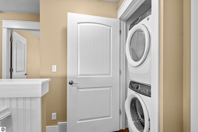 10889 Pine Bluff Dr Unit C, Traverse City, MI 49684 - laundry area with stacked washer / drying machine