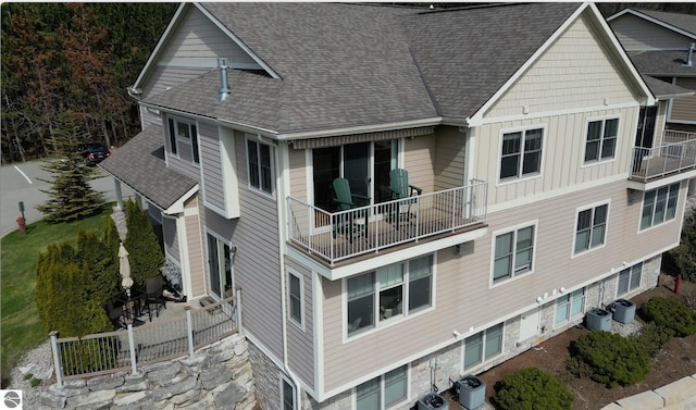 10889 Pine Bluff Dr Unit C, Traverse City, MI 49684 - view of property featuring central air condition unit