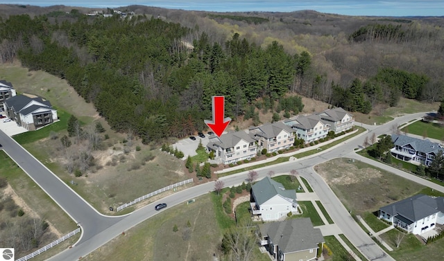 10889 Pine Bluff Dr Unit C, Traverse City, MI 49684 - aerial view of property's location with a heavily wooded area and nearby suburban area