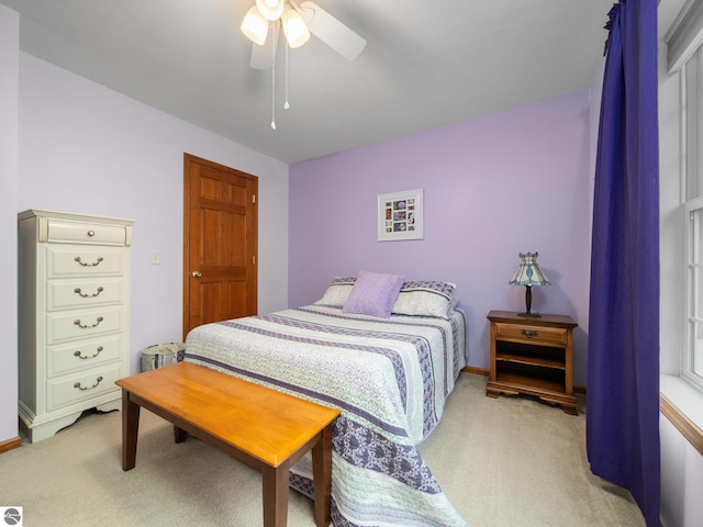 4381 Cherry Ln, Traverse City, MI 49684 - bedroom featuring light colored carpet, a ceiling fan, and baseboards