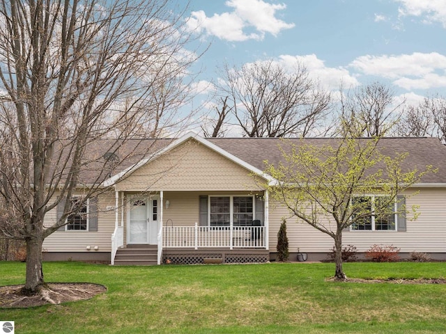 4381 Cherry Ln, Traverse City, MI 49684 - view of front of property featuring a porch, a front yard, and roof with shingles