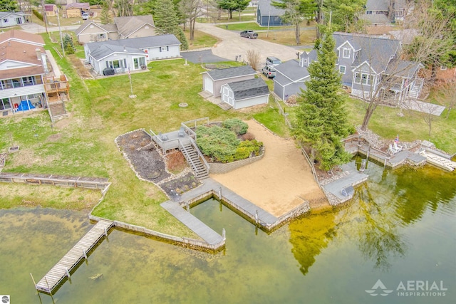 aerial view of residential area with a nearby body of water