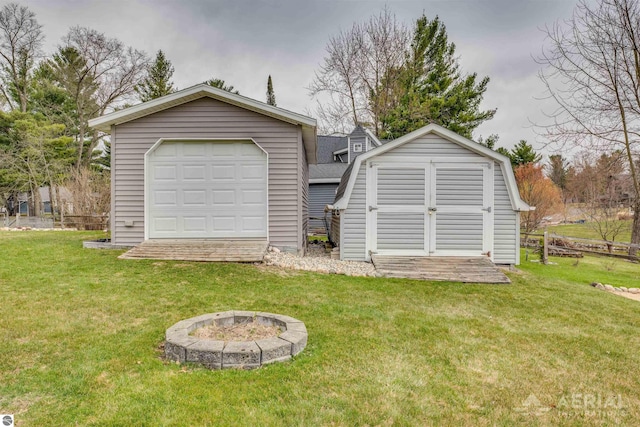 detached garage with a storage shed