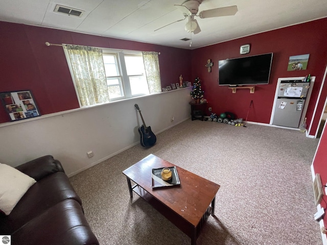 1993 W St, Central Lake, MI 49622 - living area featuring a ceiling fan, carpet, and baseboards
