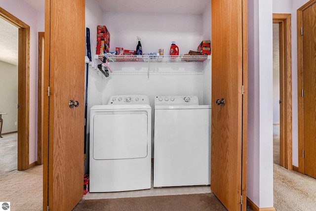 3691 Eastview Dr Unit 67, Traverse City, MI 49684 - washroom featuring independent washer and dryer and carpet