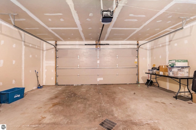 3691 Eastview Dr Unit 67, Traverse City, MI 49684 - garage with a garage door opener