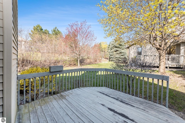3691 Eastview Dr Unit 67, Traverse City, MI 49684 - deck with a lawn
