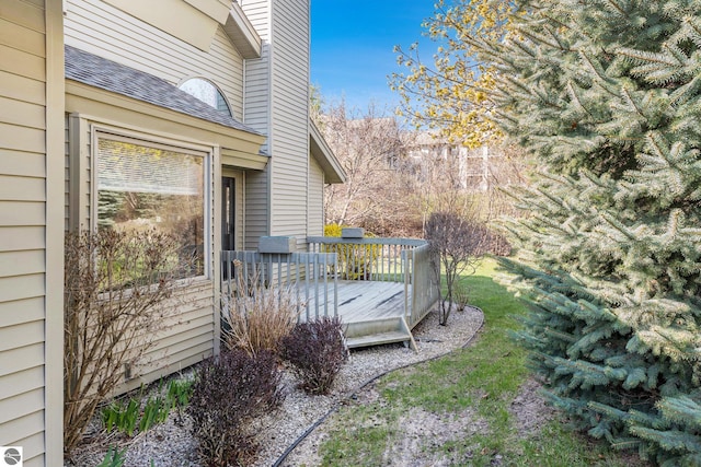 3691 Eastview Dr Unit 67, Traverse City, MI 49684 - view of yard featuring a deck