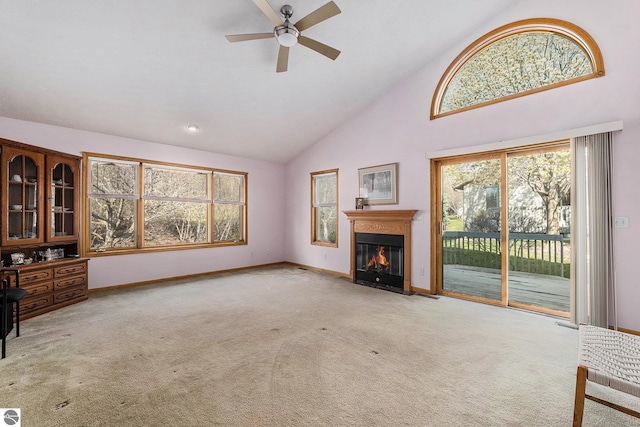 3691 Eastview Dr Unit 67, Traverse City, MI 49684 - unfurnished living room with light carpet, ceiling fan, plenty of natural light, and high vaulted ceiling