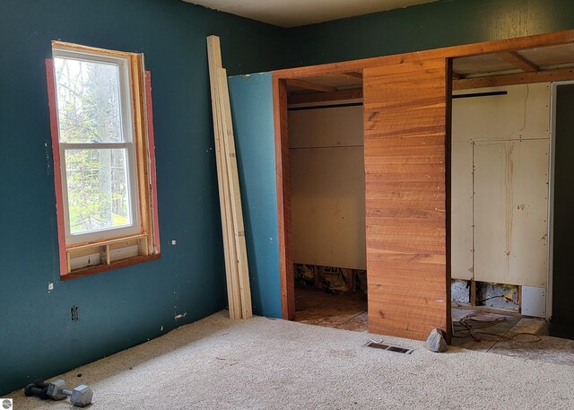21187 Parkview Rd, Tustin, MI 49688 - unfurnished bedroom with carpet and a closet