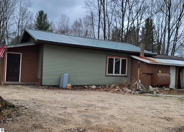 21187 Parkview Rd, Tustin, MI 49688 - view of side of property featuring oil tank and metal roof