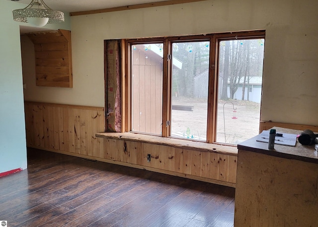 21187 Parkview Rd, Tustin, MI 49688 - spare room featuring hardwood / wood-style floors, a wainscoted wall, and wood walls